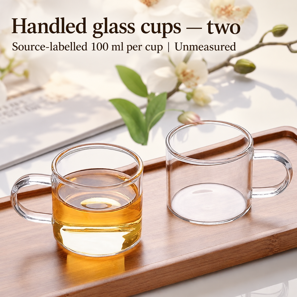 Handled glass cups — two