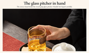 The glass pitcher in hand