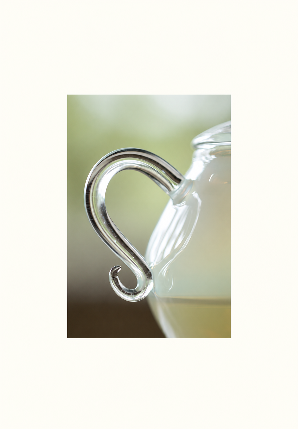 A curved glass handle