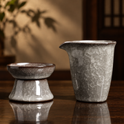 Serving pitcher with strainer and stand