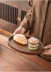 An oval tray in hand